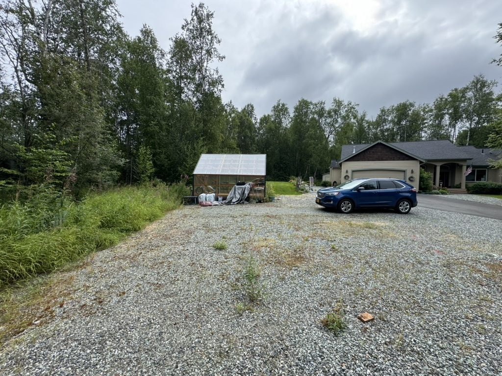 Empty gravel pad before the carport build