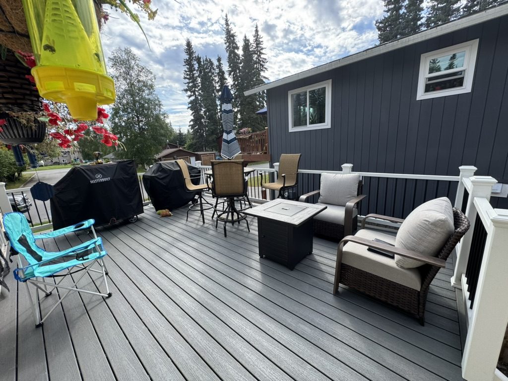 Outdoor deck addition set up for lounging and grilling